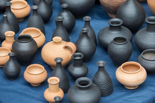 Clay vessels of different colors. Ceramics