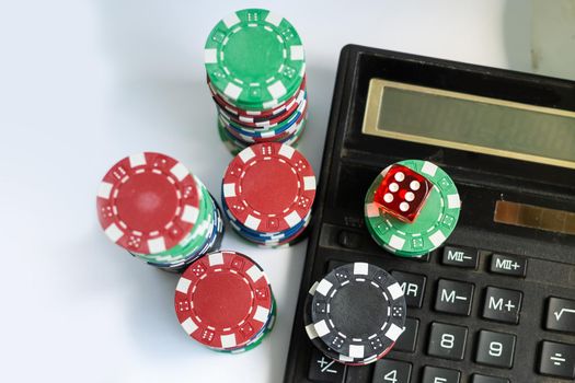 view of calculator among gambling chips