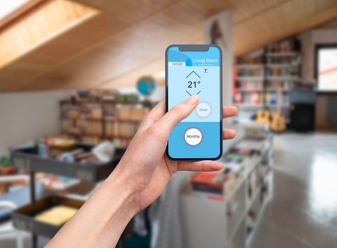 Hand using home automation app for home smart technology