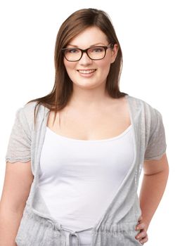 Casual confidence. A pretty full-figured woman posing confidently on a white background.