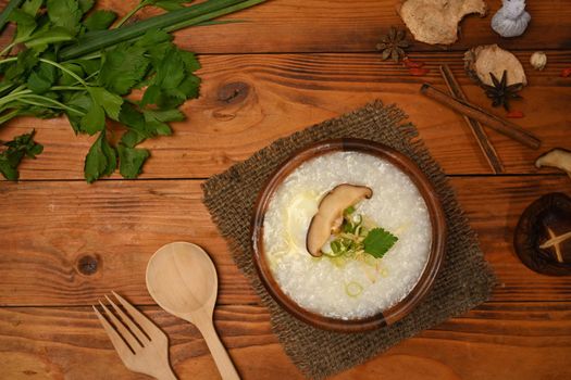 Testy rice porridge on wooden table breakfast or light meal. Top view