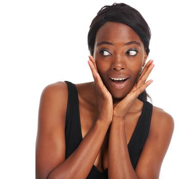 Im so surprised right now. Young African woman looking shocked and surprised while isolated on white - copyspace.