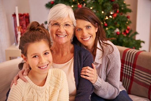 We wish you a Merry Christmas. Show of three-generations of a family celebrating christmas together.