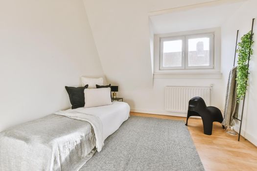 Attic bedroom with minimalist interior design