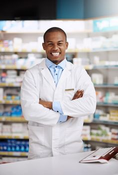 Looking for expert advice Im right here to help. Portrait of a young pharmacist working in a chemist.