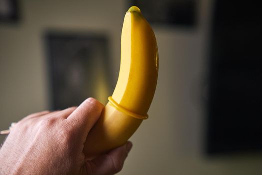 Condom and yellow banana