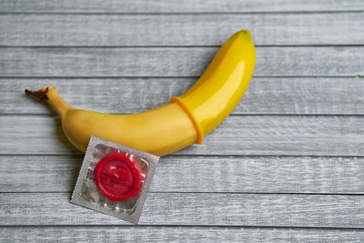 Condom and yellow banana