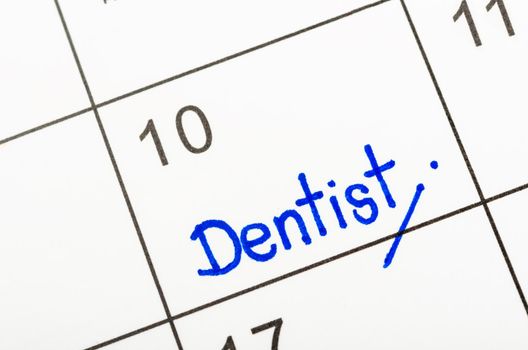 Dentist appointment wirting calendar to remind you an important appointment.