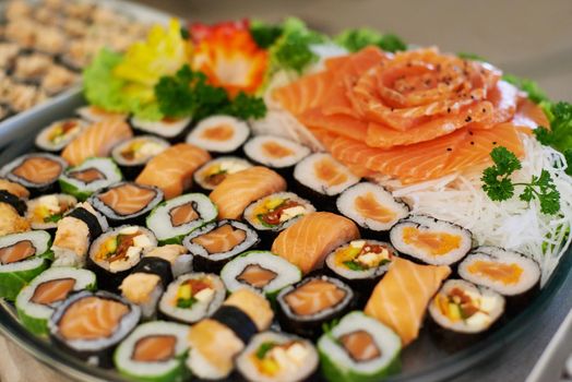Sushi snacks. A selection of sushi arranged on a platter.