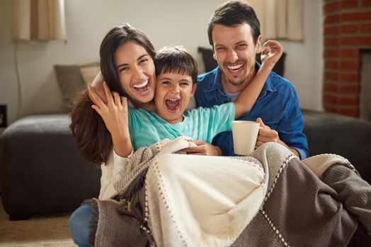 Hes brought a world of excitement to our lives. Shot of a cheerful young couple and their son spending some time together at home.