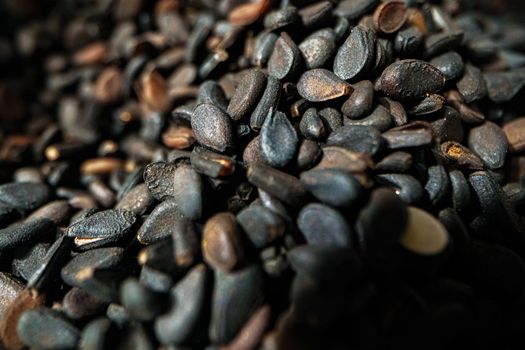 Pile of black seeds macro shot background