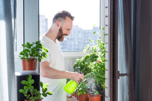 Man growing city balcony garden