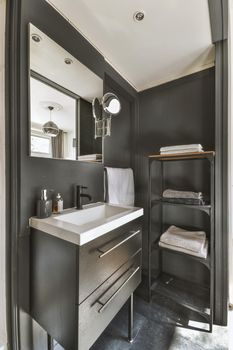 Interior of modern bathroom with cabinet and sink