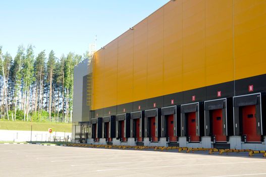 Large distribution warehouse with gates for loading goods.