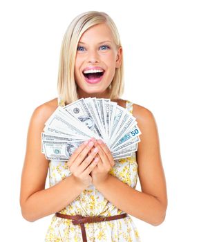 Money can buy happiness. Attractive woman smiling while holding a fan of dollar bills - isolated on white.