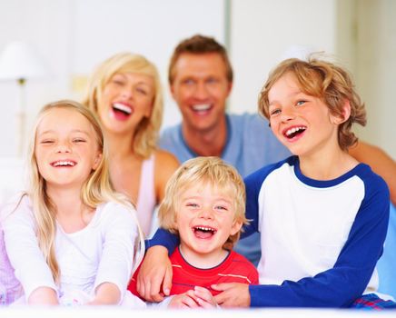 Happy family - Cheerful middle aged couple with their children. Happy family - Portrait of cheerful middle aged couple with their children.