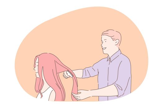 Hairdresser during work, hairstylist brushing hair concept