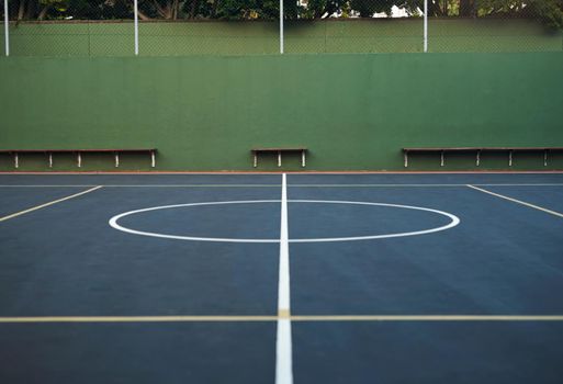 Court is in session. Shot of an empty basketball court.