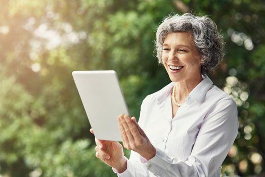 Just got email confirmation on another successful deal. Cropped shot of a mature businesswoman working on a digital tablet.