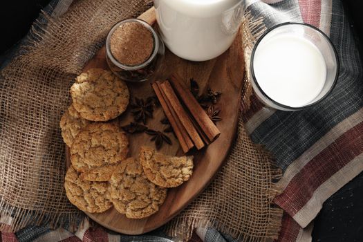 Glass of milk and cookies on table