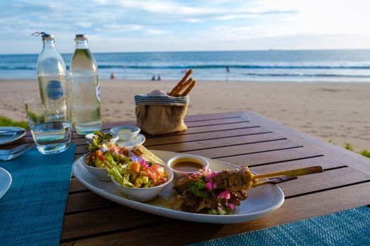 Thai food on a table on the beach in Thailand Thai sate