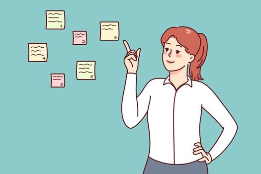 Businesswoman prioritize to do list on notes