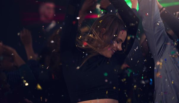 The perfect way to end the year. Cropped shot of an attractive young woman dancing in a nightclub.