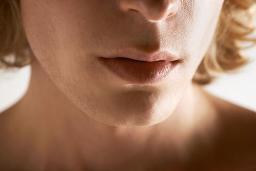 The male mouth. Cropped image of a young mans mouth.