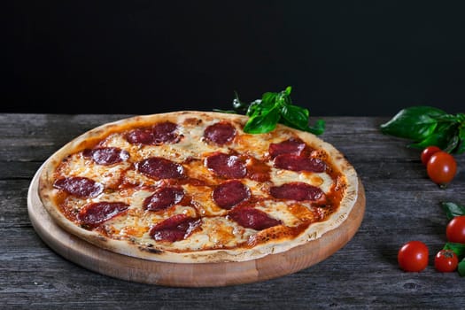 Pepperoni pizza with salami and cheese.