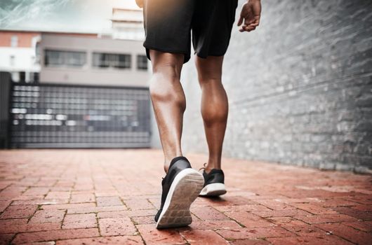 Legs that are built to last. Closeup shot of an unrecognizable man exercising outdoors.