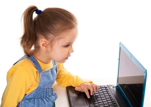 Little Girl Using Laptop - Isolated - Stock Image