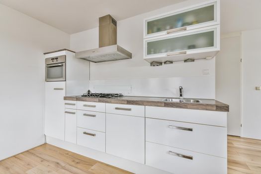 Kitchen with minimalist style cupboards