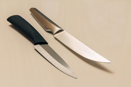 Two kitchen knives on a white background