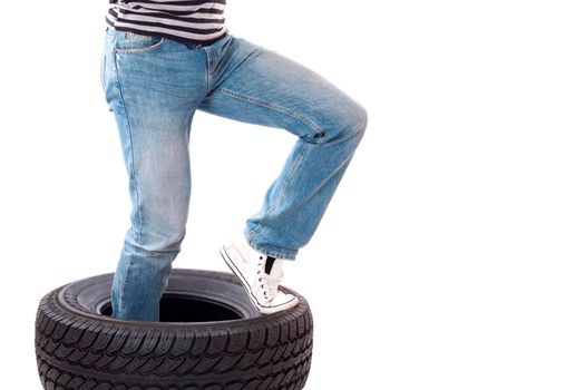 Tire. Man with car wheel.