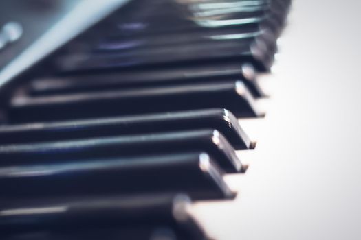 Close-up of piano keys. Close frontal view. Music instrument education concept idea