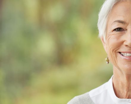 Portrait of one happy senior caucasian woman with copyspace. Face of carefree cheerful retired female smiling at the camera. Carefree, relaxed and wise old woman optimistic about life and aging