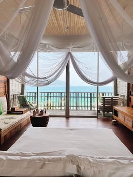 Interior design decor furnishing of luxury show home holiday villa bedroom
