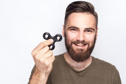 young man holding spinner