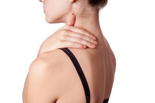 Closeup view of a young woman with shoulder or neck pain