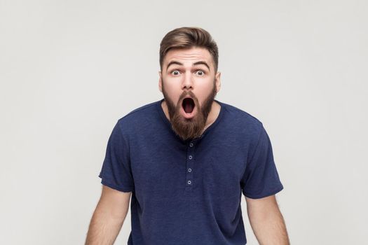 Unbelievable news! Young adult man open mouth and shocked