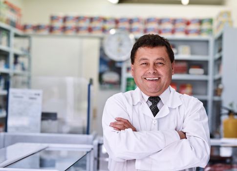 Health related expertise you can trust. Portrait of a male pharmacist in a pharmacy.