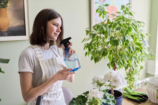 Gardening of apartment with house plants, teenage girl caring for potted plant