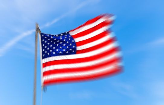 Close up Flag of United States of America waving in the wind with motion blur effect