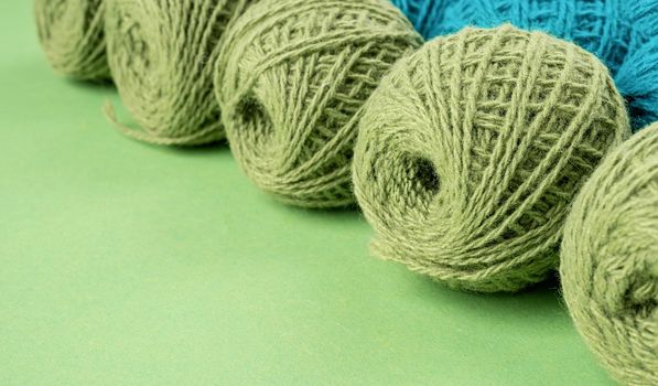 bright green yarn wool in a raw on bright background