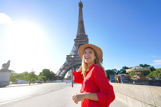 Let's explore Europe. Excited traveler girl visiting Paris, France. Wide angle.