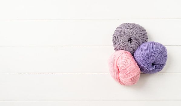 pastel colored yarn wool on marble background