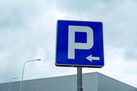 Blue road sign Parking with left arrow