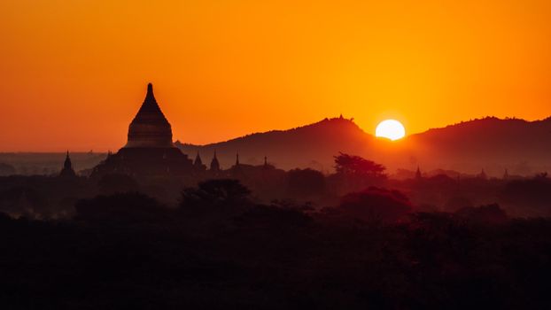 Bagan Myanmar, Pagodas and temples of Bagan, in Myanmar, formerly Burma, a world heritage site during sunrise