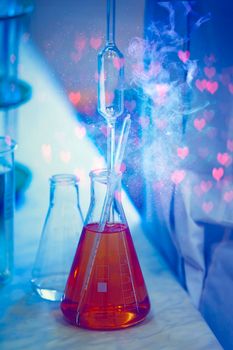 Glass laboratory flasks with chemical substance and magic glow. Making a magical love potion for fortune telling.