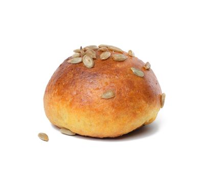 Round baked bun with sunflower seeds on a white isolated background